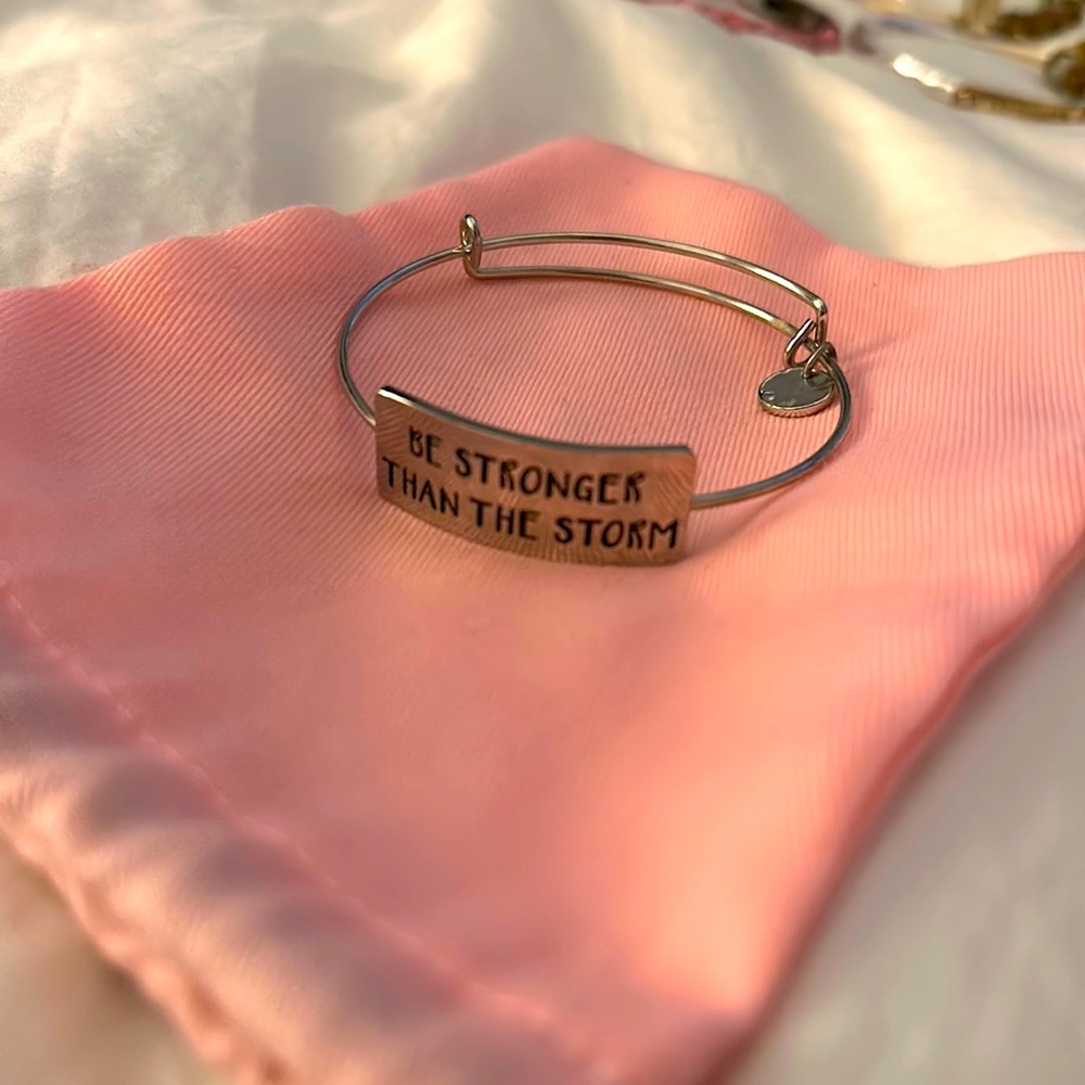 “Be stronger than the storm.” Silver bracelet